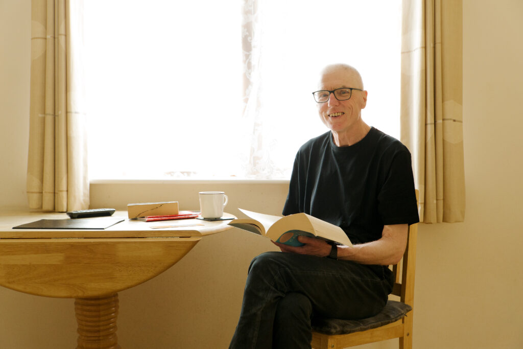 A photo of a man reading a book