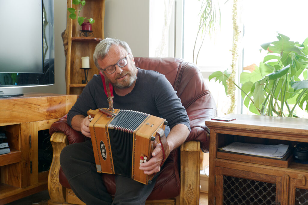 A photo of a man playing an instrument